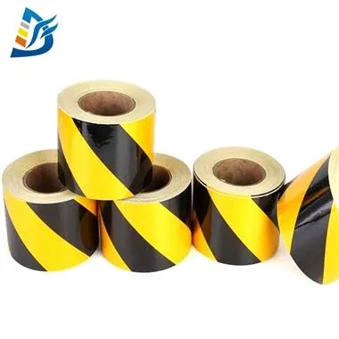 Melna un dzeltena atstarojoša lente